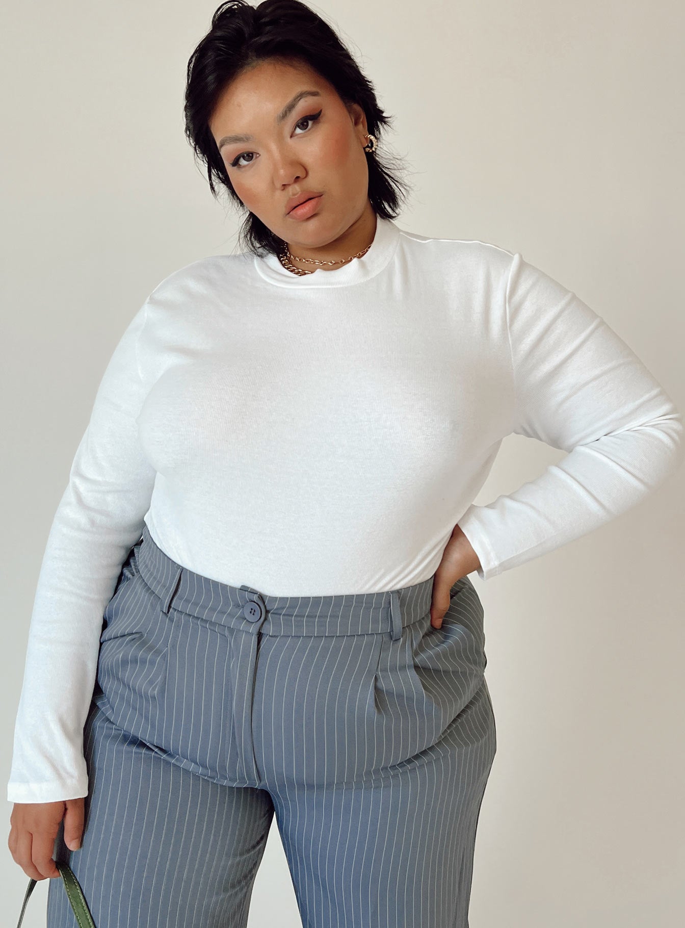 front view of model wearing Princess Polly Maleny Long Sleeve Bodysuit White Curve Full Sleeves Crew Neck 