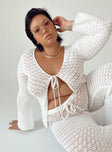 Long sleeve top Crochet material  Wide neckline  Tie fastening at front  Flared sleeves 