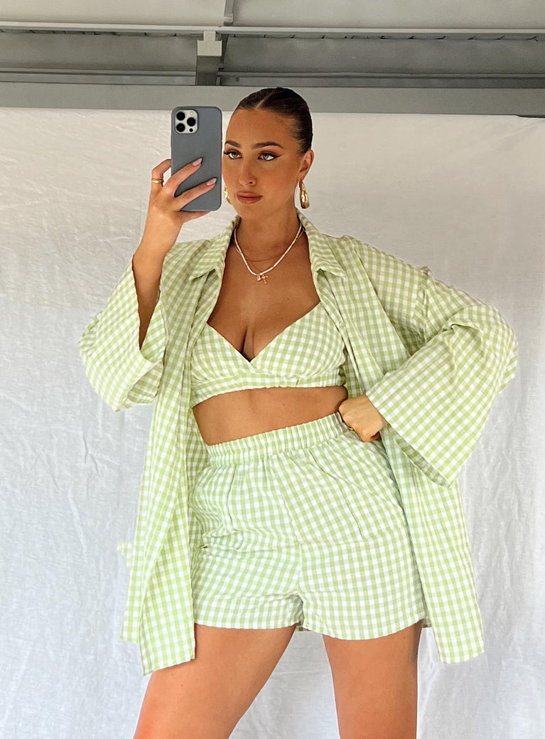 Three piece matching set Check print Long sleeve shirt Classic collar Button fastening at front Crop top Adjustable shoulder straps V-neckline Elasticated band at bust Shorts Elasticated waistband  Twin hip pockets