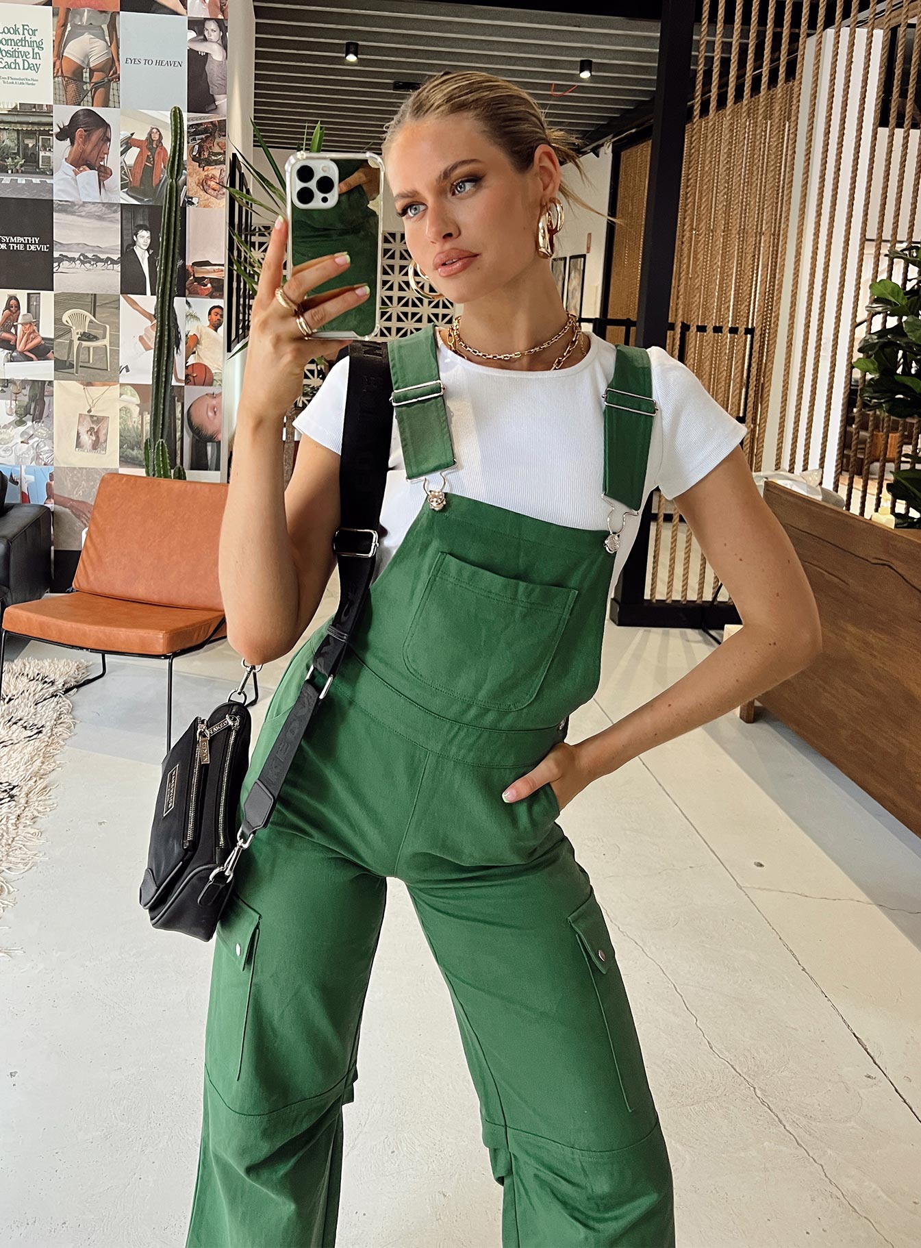 Overalls Cargo style Adjustable shoulder straps  Chest pocket  Button fastening at hips Six leg pockets  Silver-toned hardware  Wide leg  Pleated detail at inner leg