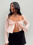 Long sleeve top Wide square neckline Tie fastening at bust Open front design Frill hem