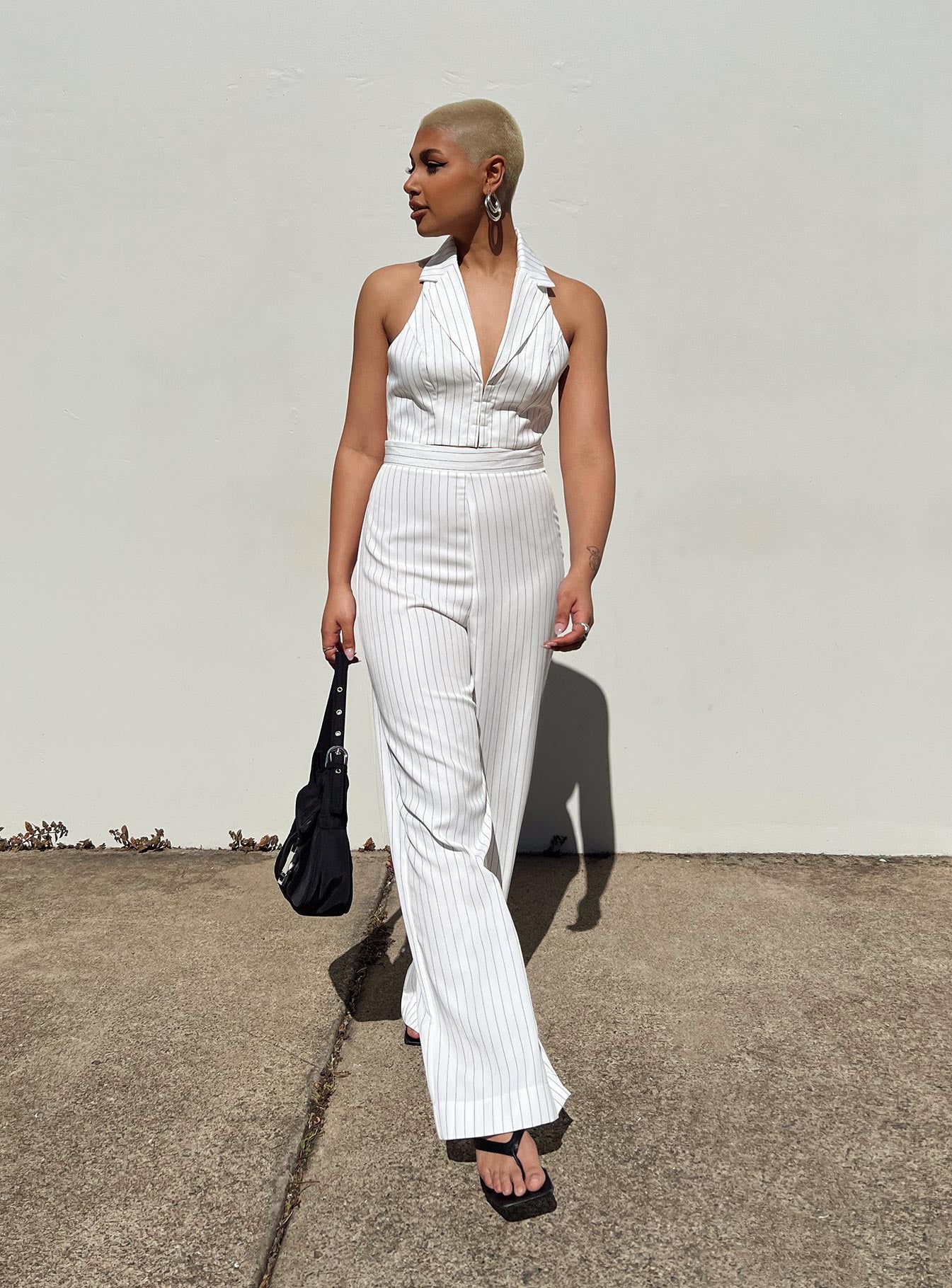 White matching set Pinstripe print Vest top Halter neck Hook & eye fastening at front Tailored pants Invisible zip fastening at side Wide leg