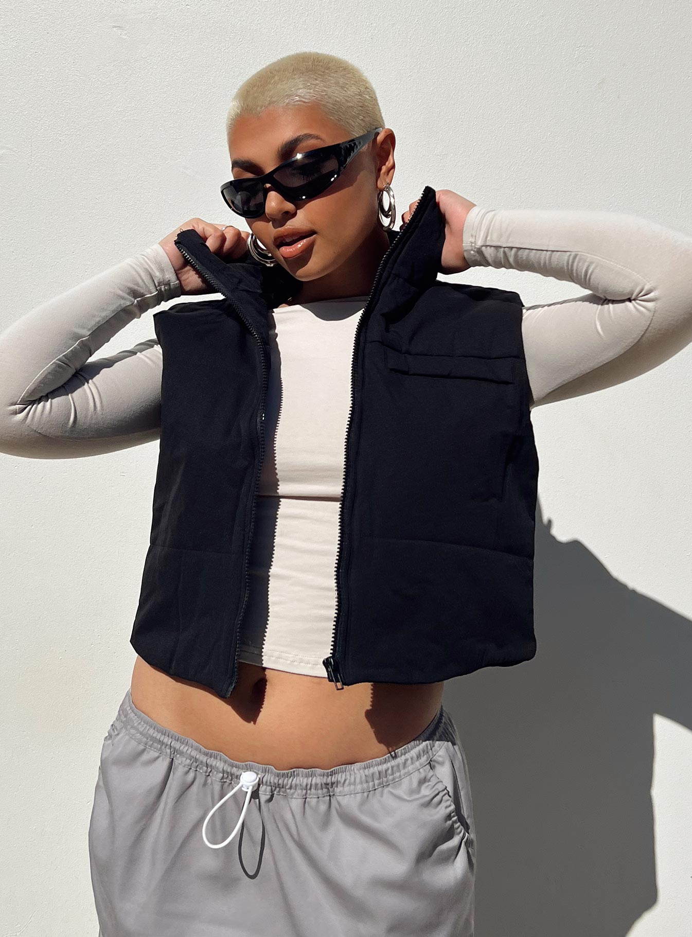 Black puffer vest High neck Zip front fastening  Faux chest pocket 