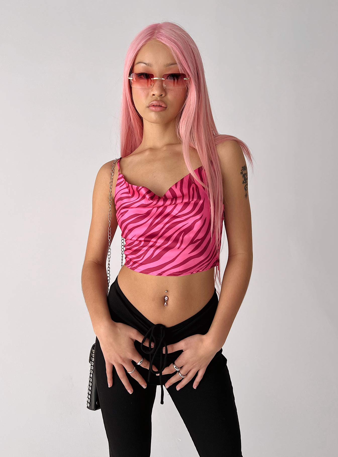 side view of model wearing Princess Polly Gia Top Pink Sleeveless Cowl 