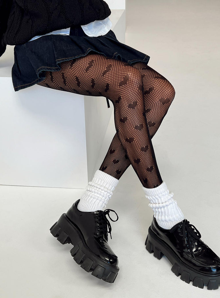 Black stockings High waisted fit Fishnet design Heart print Sheer design Hand wash only 