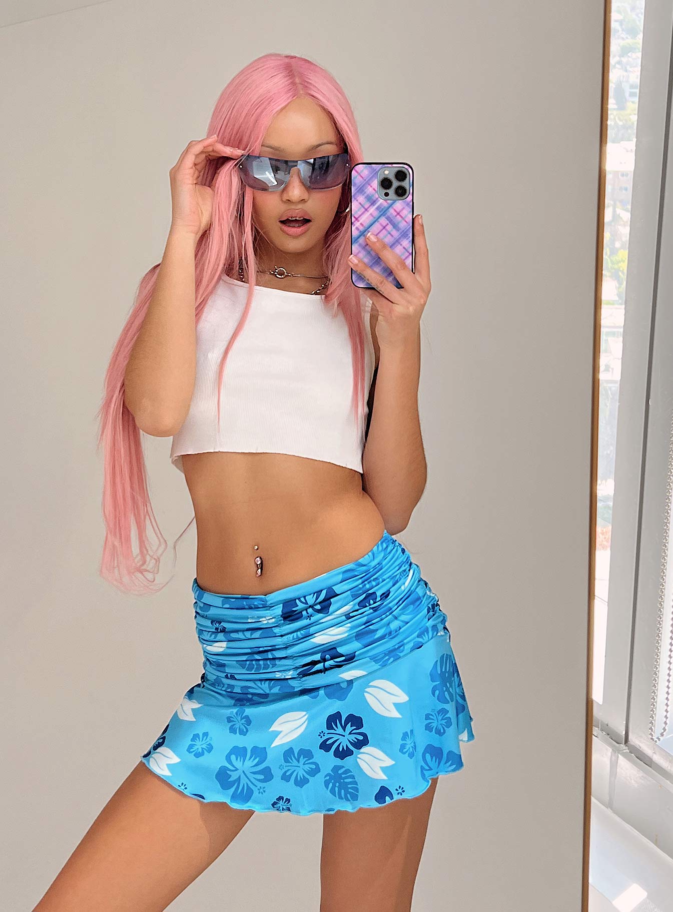   side view of model wearing Princess Polly Amelia Mini Skirt Blue Mini Skirts 