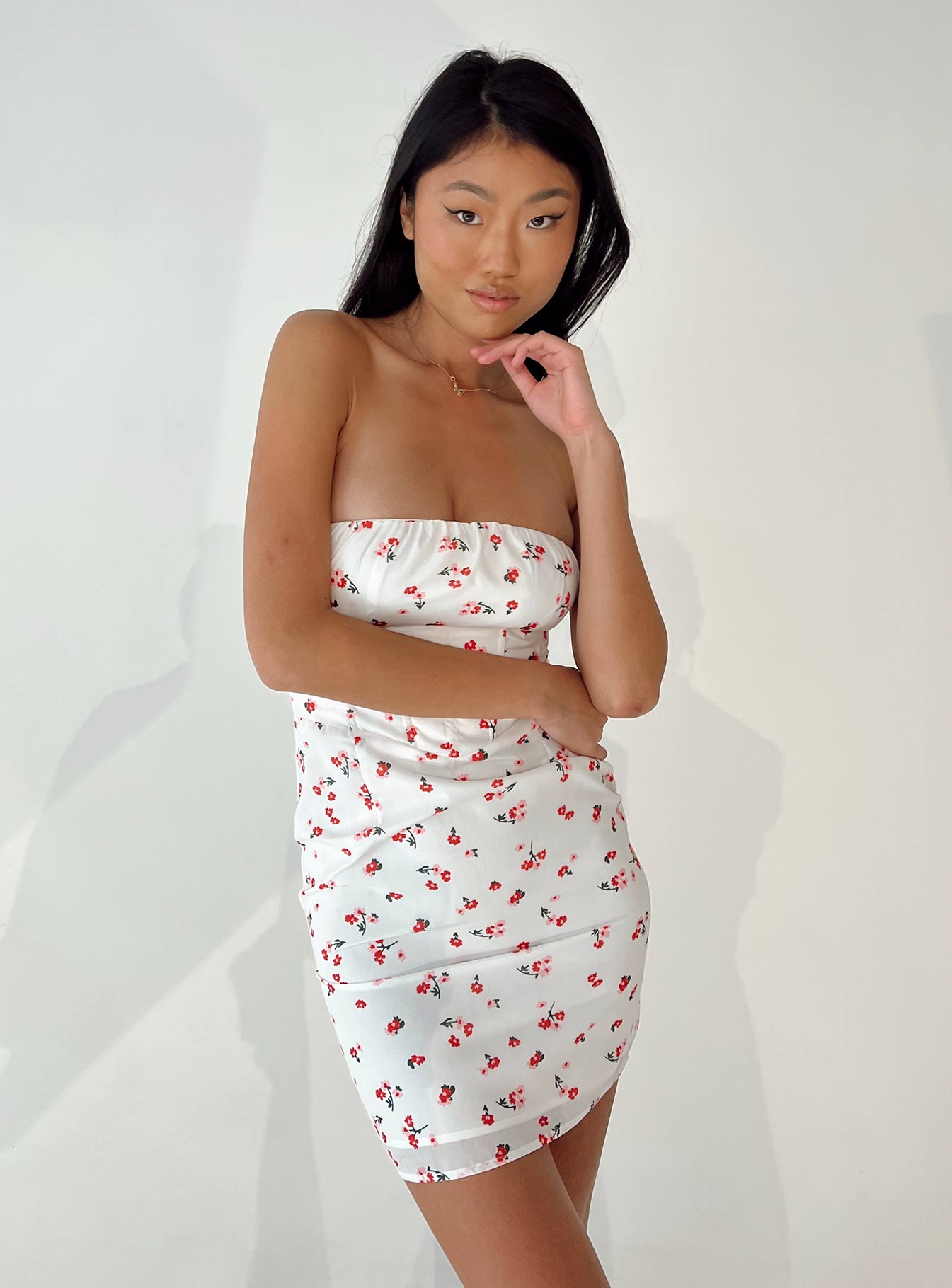 back view of model wearing Princess Polly Ivy Corset Mini Dress White Floral 