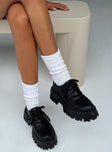 Platform shoes Faux patent leather Lace up fastening Chunky tread Rounded toe Padded footbed 