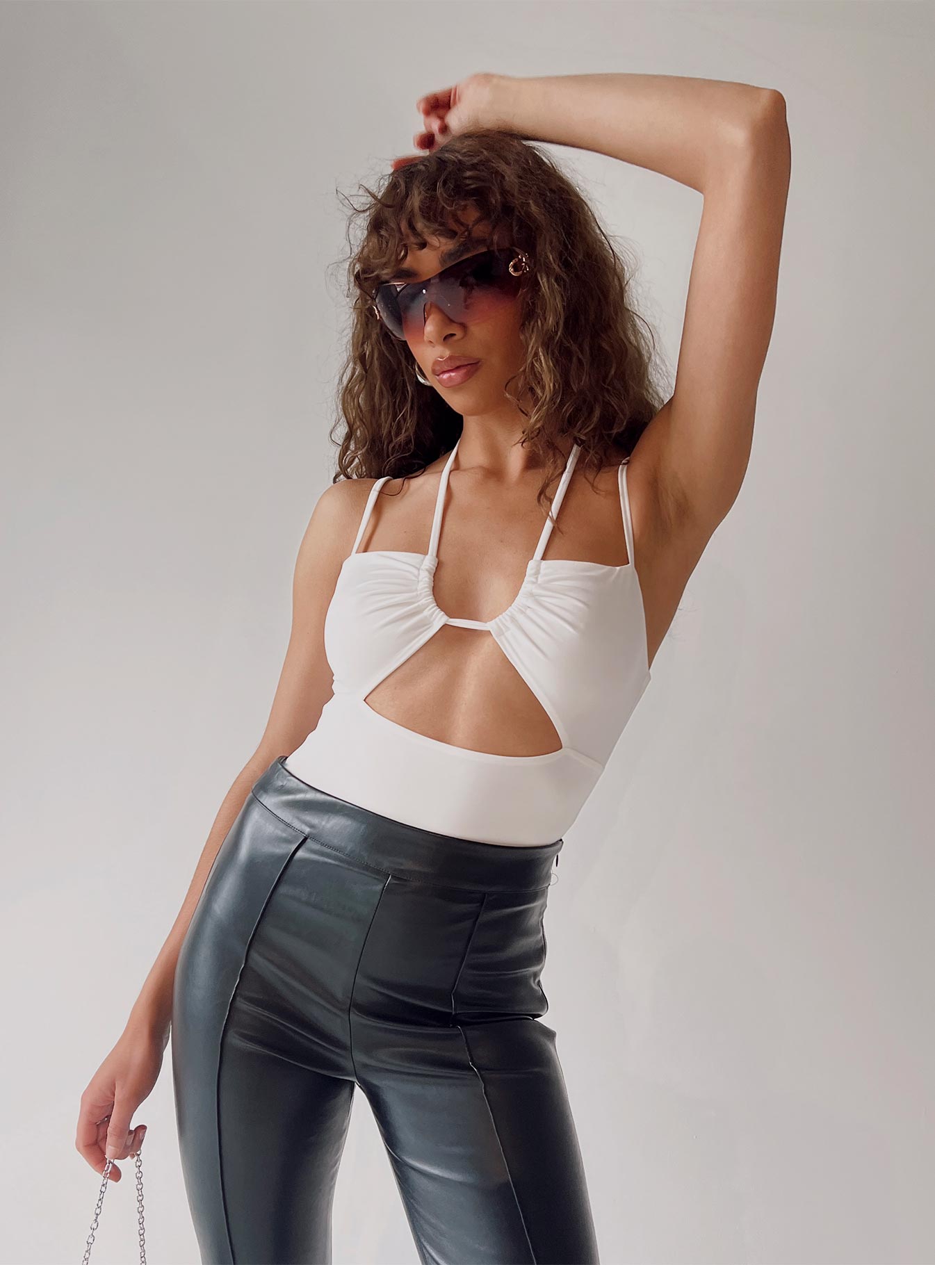 side view of model wearing Princess Polly Dargo Bodysuit White Sleeveless Square Neck 