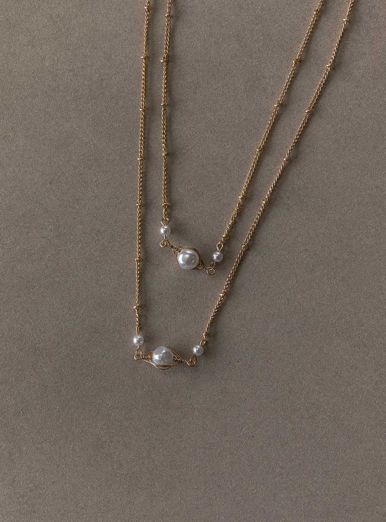 Necklace set Set of two - these can not be worn separately  Gold-toned chain Pearl pendants  Lobster clasp fastening 