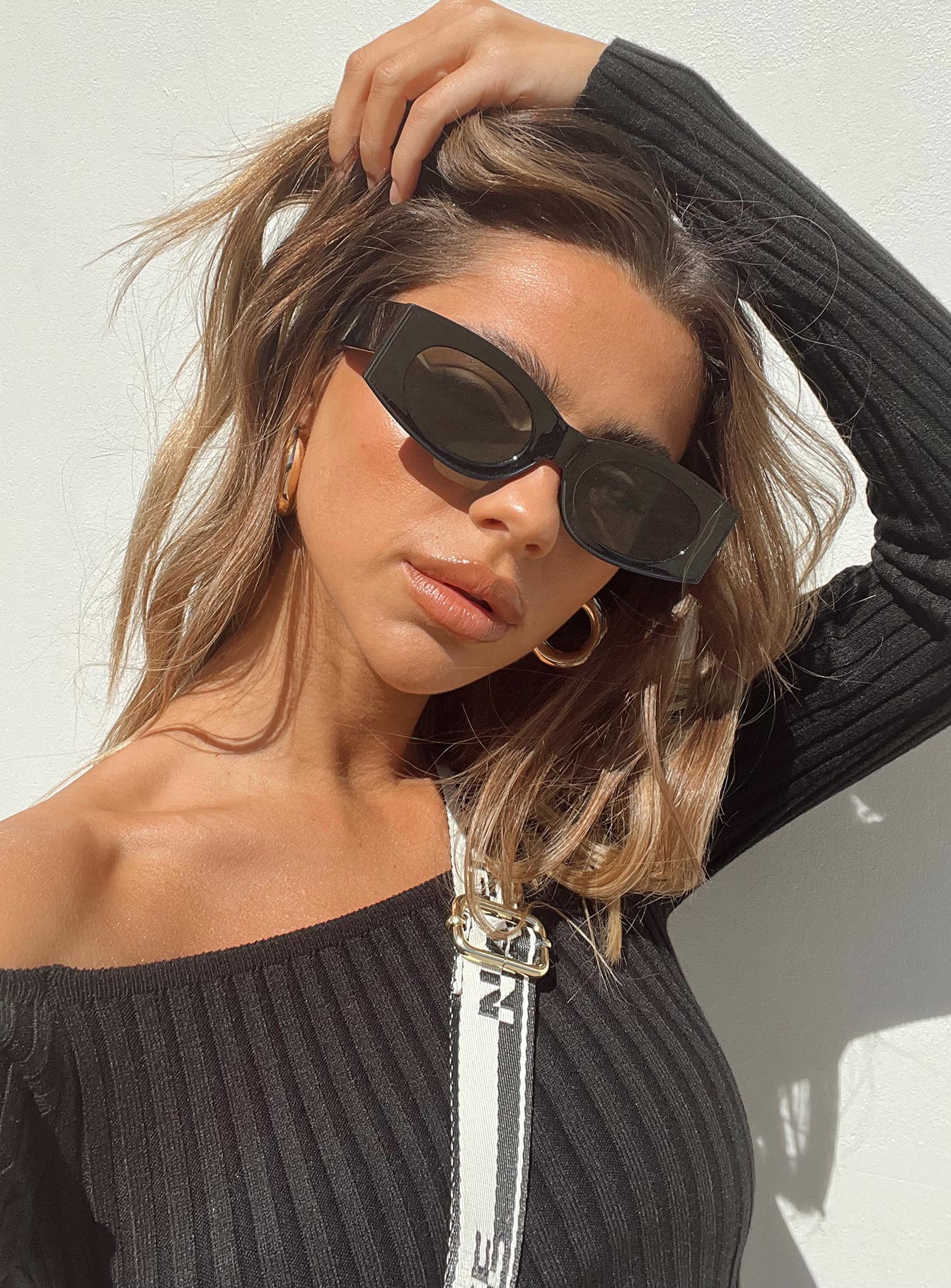 Black sunglasses Tinted lenses Moulded nose bridge 