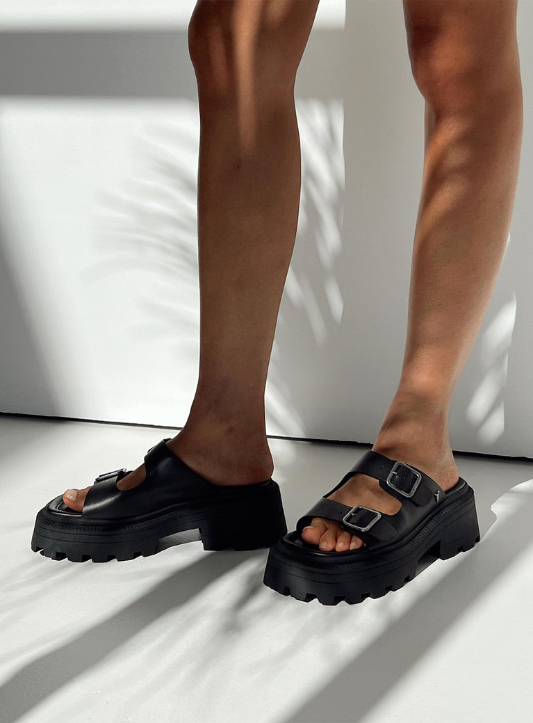 Black Sandals Faux leather material Platform base Square toe Double strap upper Silver toned buckles Padded footbed Treaded sole