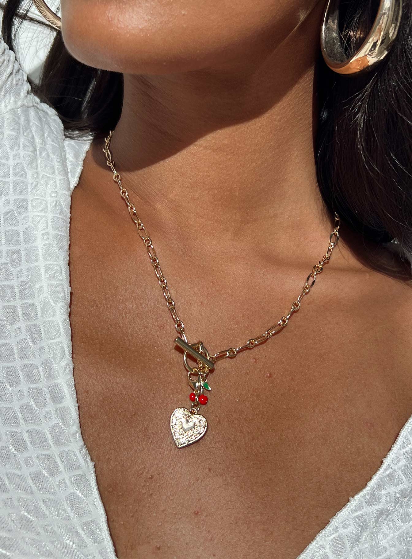 Necklace Gold toned Drop charms Lobster clasp fastening