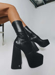 Boots  Faux leather material  Platform base  Square toe  Block heel  Fitted leg 