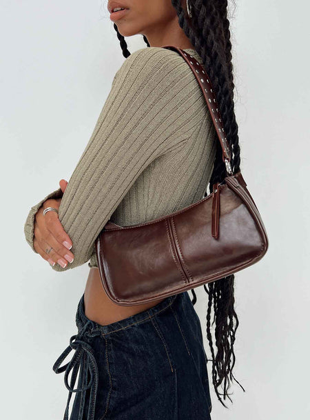 Dark brown bag Faux leather material Zip fastening Adjustable & removable cross-body strap Removable fixed shoulder strap Internal pocket Silver toned hardware Flat base