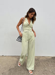 Green matching set High waisted pants  Zip & button fastening  Elasticated back band  Belt looped waist  Twin hip pockets Wide leg  Vest top  Lapel collar  Button front fastening 