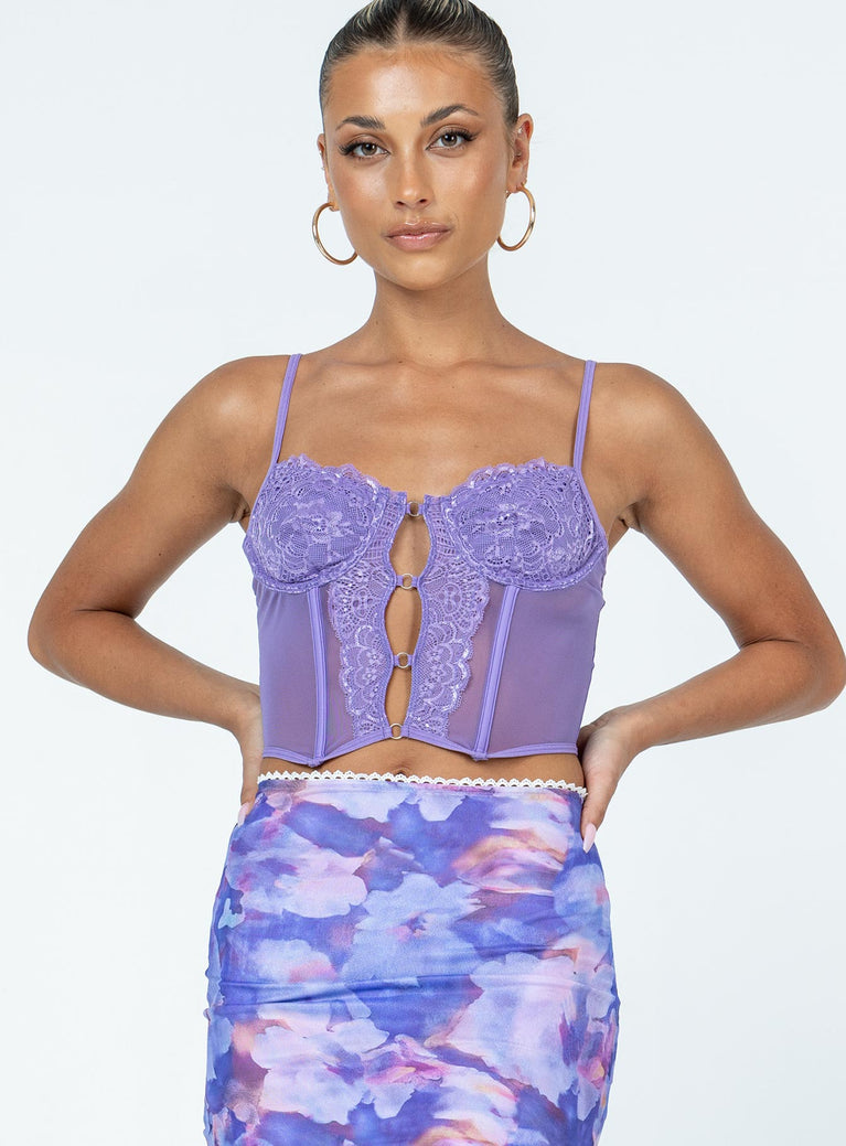 Crop top Sheer mesh material  Lace detailing  Adjustable shoulder straps  Wired cups  Fixed hoops down the front  Boning throughout Pointed hem