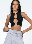 Crop top  Slim fitting  100% polyester  Ribbed material  Open front  Good stretch  Unlined 