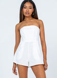 White romper Strapless design  Inner silicone strip at bust  Boning through front  Twin hip pockets  Lined top 
