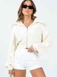 Sweater 100% polyester  Knit material  Turtle neck  Zip front fastening  Drop shoulder  Cropped design 