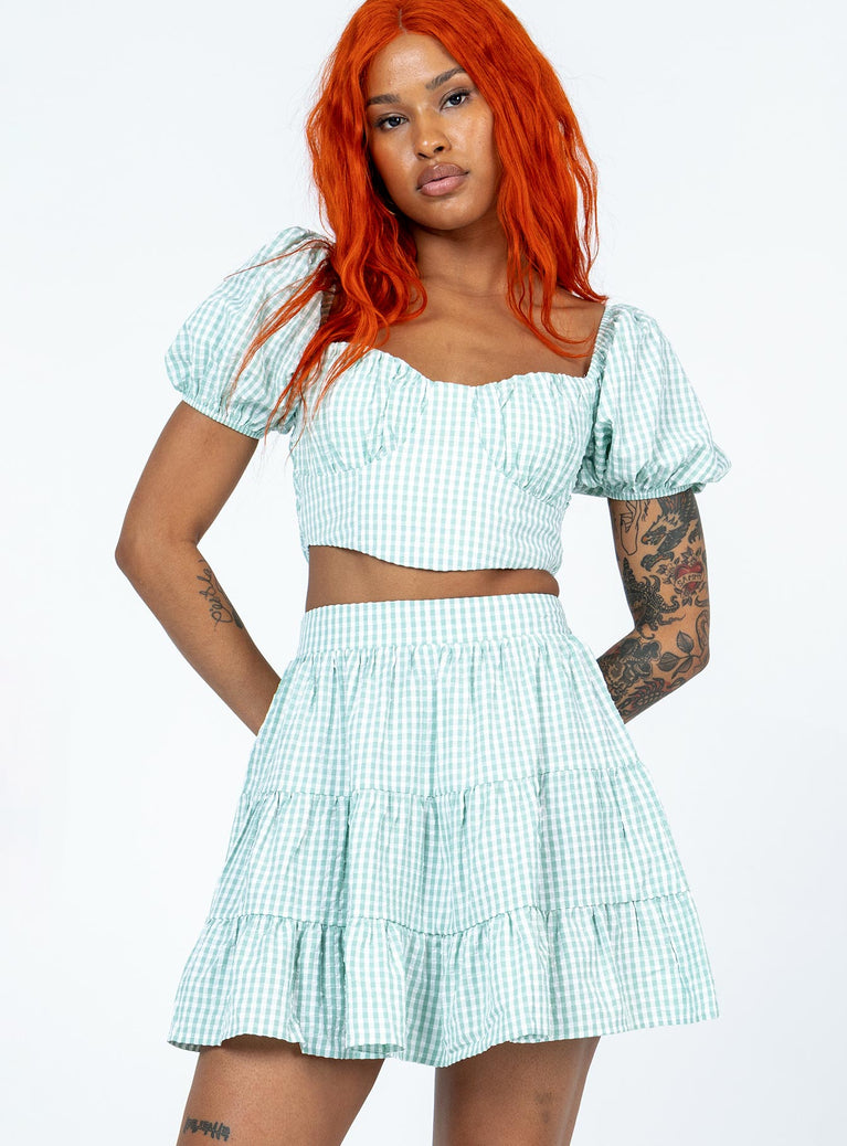 Matching set Gingham print  Crop top  Puff sleeves  Back tie fastening  Shirred back  High waisted mini skirt  Elasticated waistband  Lined top 