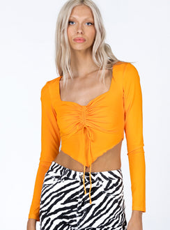 front view of model wearing Princess Polly Kenzie Long Sleeve Top Orange 