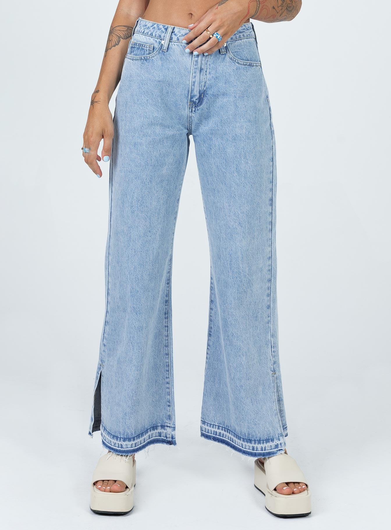 front view of model wearing Princess Polly Holmes Low Rise Frayed Hem Denim Jeans Mid Rise 