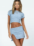 Blue matching set Detailed material  Cropped tee Low-rise mini skirt  Elasticated waistband  Side slit 