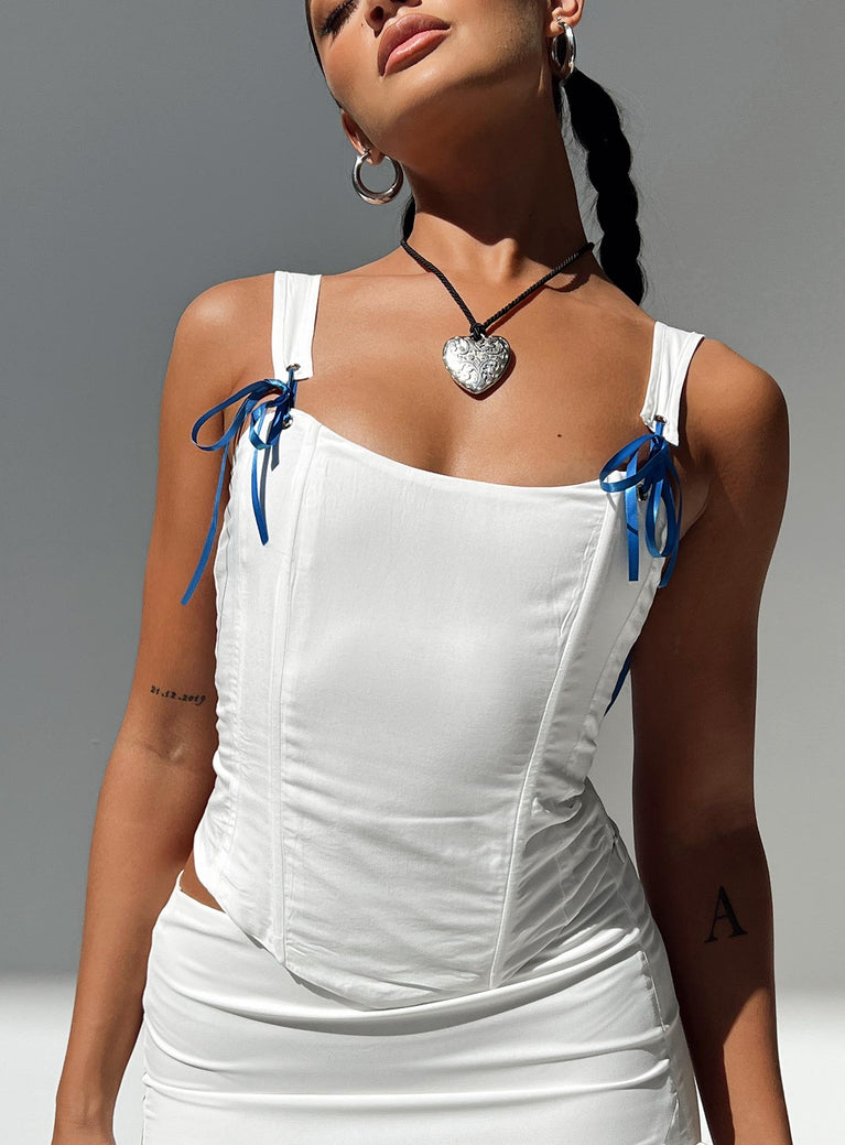 White corset slim fitting Adjustable & removable straps Can be worn on or off the shoulder Boning through front Invisible zip fastening at side Adjustable lace-up fastening at back Pointed hem