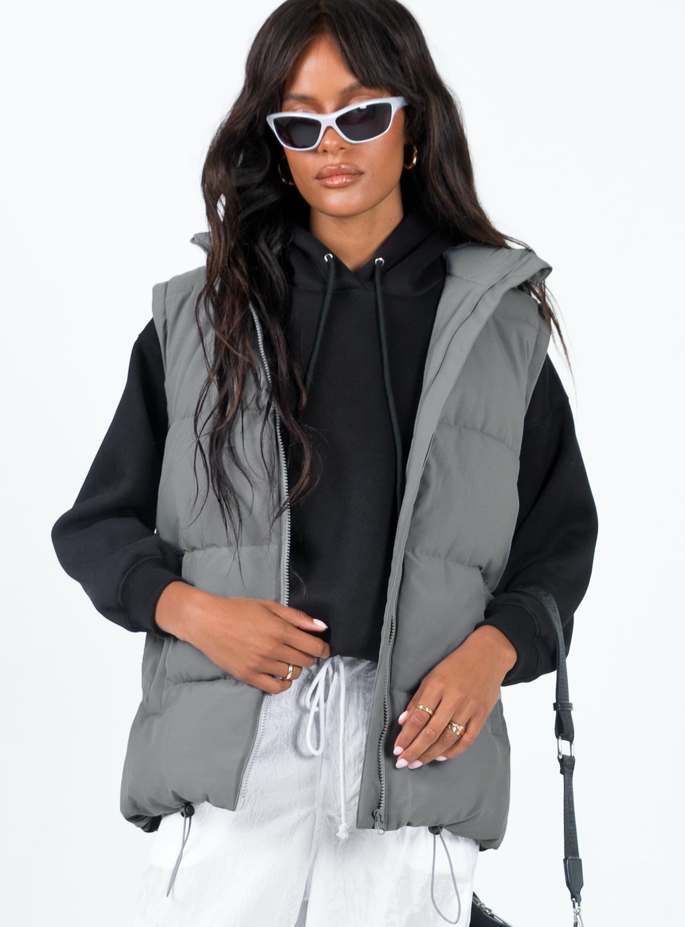 Oversized puffer vest High neck Front zip fastening Twin hip pockets Adjustable drawstring hem