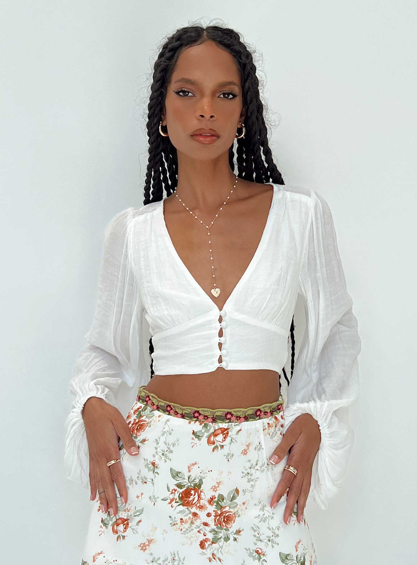 front view of model wearing Princess Polly Castlereagh Top White Full Sleeves Plunger 