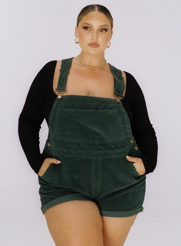 Green overalls 100% cotton Cord material Button sides Multiple pockets Fixed rolled hem Adjustable straps