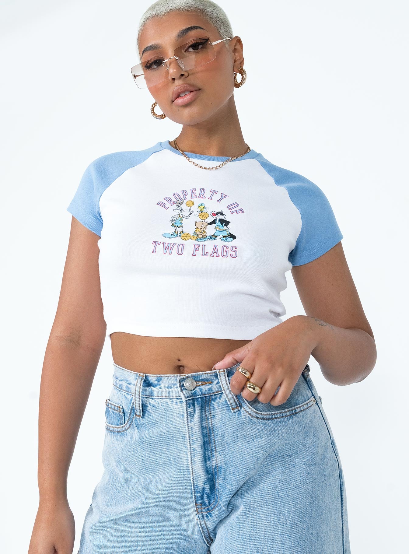 front view of model wearing Princess Polly Looney Tunes Two Flags Cropped Tee White / Blue Short Sleeves Crew Neck 