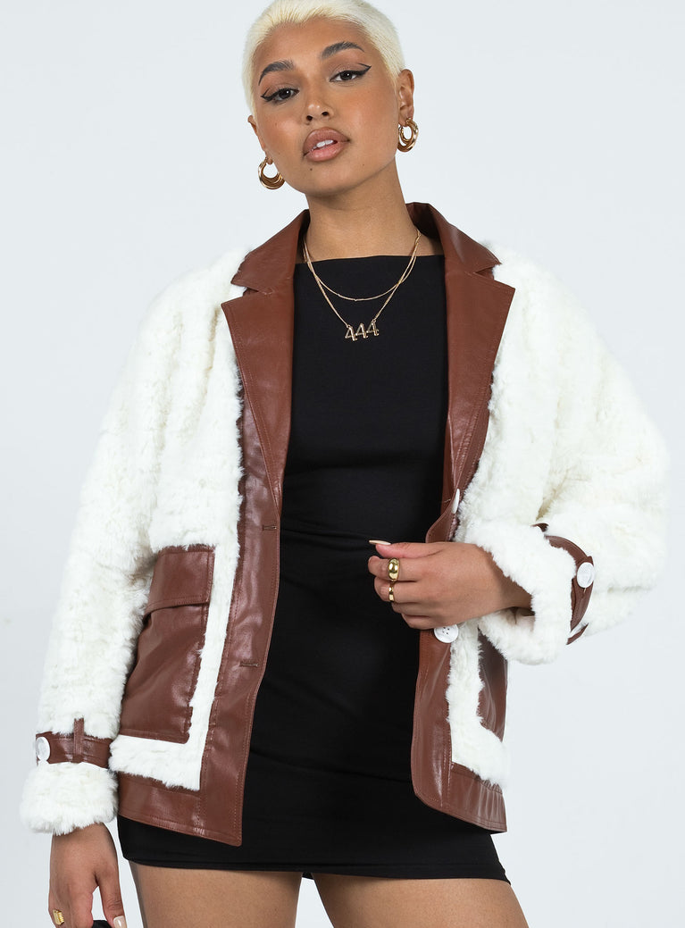 Jacket Faux fur & faux leather material Lapel collar Button fastening at front Twin hip pockets Adjustable button cuff Non-stretch
