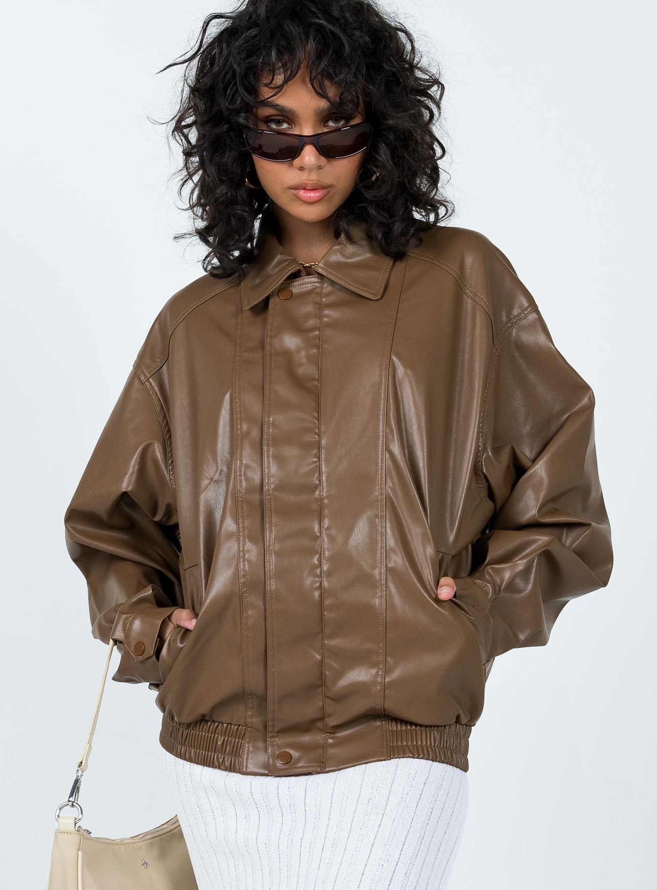 Jacket Faux leather material Classic collar Zip & press button fastening at front Elasticated hem & cuffs Twin hip pockets