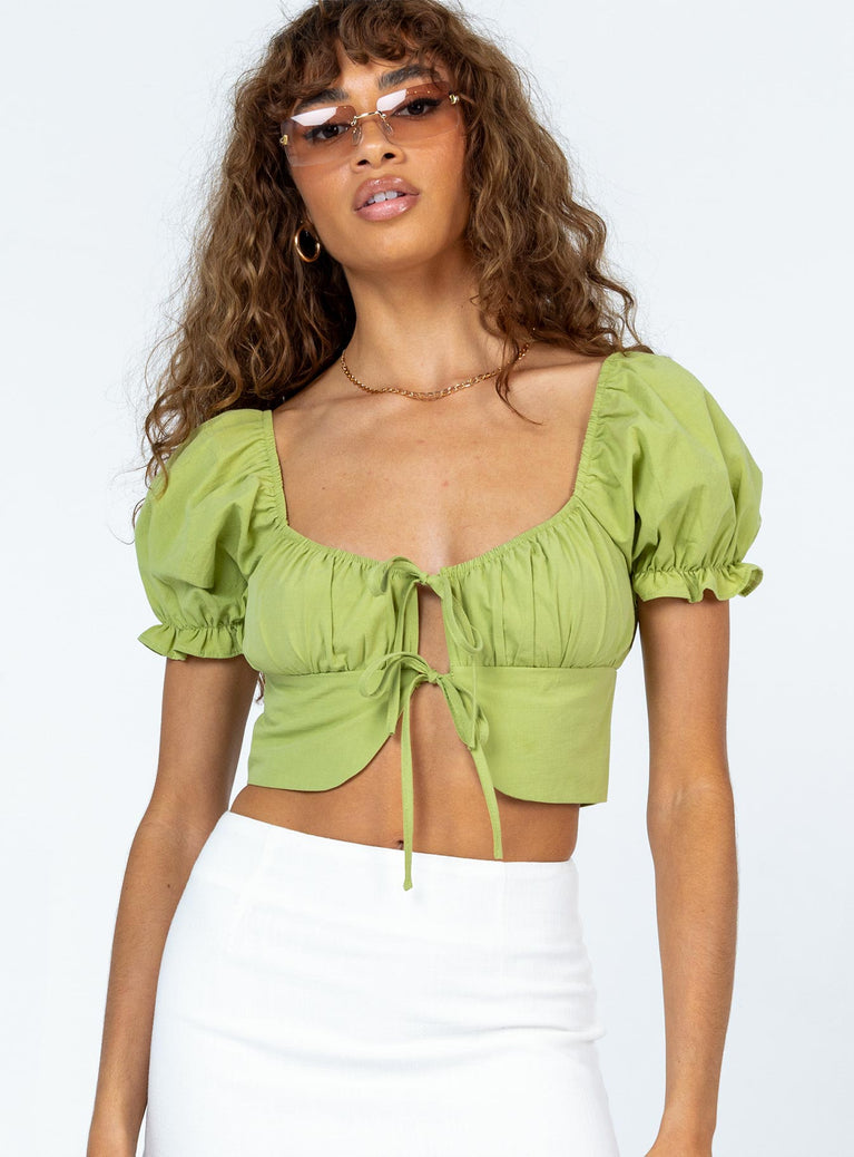 Crop top  100% cotton  Elasticated shoulders  Puff sleeves  Double tie front fastening  Gathered bust 