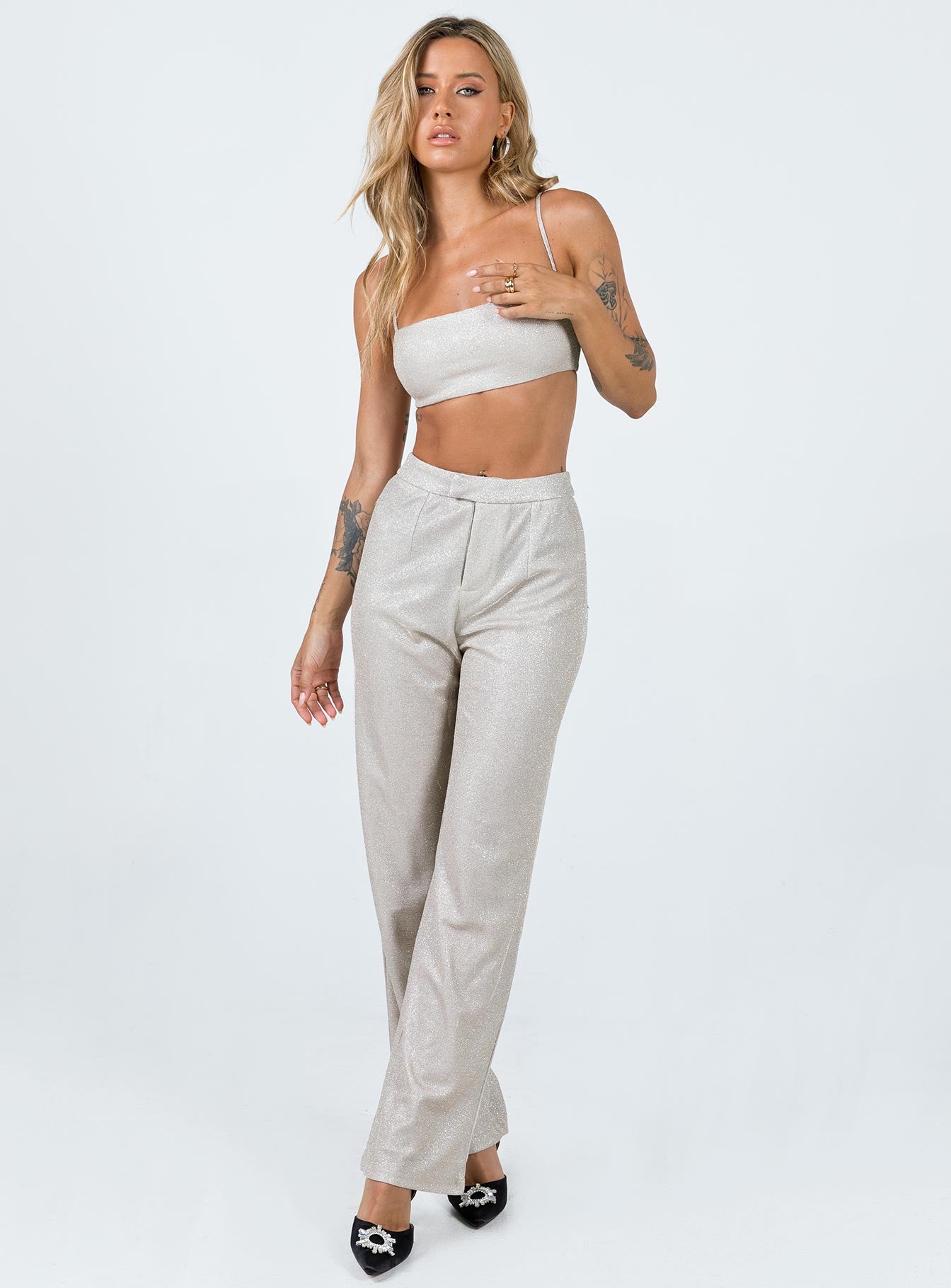 Matching set Sparkly material Crop top Adjustable shoulder straps Zip fastening at back Pants High rise Zip & clasp fastening  Subtle pleats at waist Straight leg