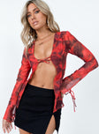 Red long sleeve top Sheer material  Printed design  Collared design Tie front fastening  Open front  Tie fastening at cuffs 