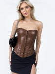 Bustier top Faux leather material  Strapless design  Sweetheart neckline  Boning through front  Hook & eye fastening 