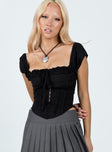 Corset top Puff sleeve Tie fastening at bust Hook & eye fastening at front Invisible zip fastening at side Curved hem