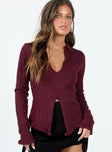 Long sleeve top Ribbed knit material  Low cut neckline  Split front hem  Good stretch  Unlined 