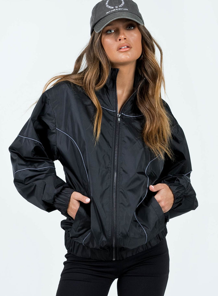 Jacket Windbreaker material  Piping detail throughout  Mock neck  Zip fastening  Elasticated waistband & cuffs 