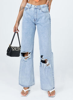 back view of model wearing Princess Polly Maple Flare Jeans Knee Rips Light Wash Denim Mid Rise 