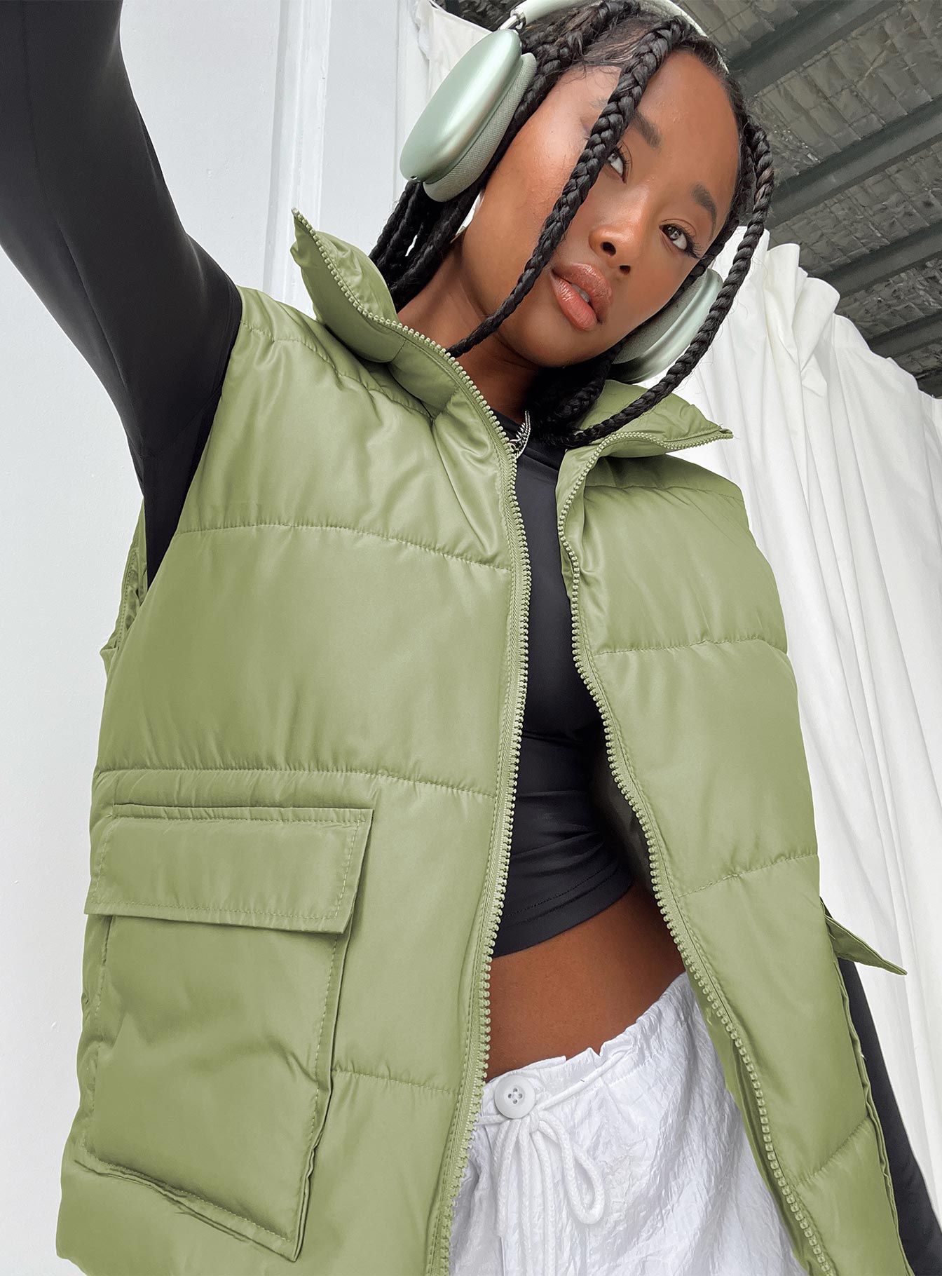 Puffer vest High neck Zip front fastening Twin hip pockets Non-stretch