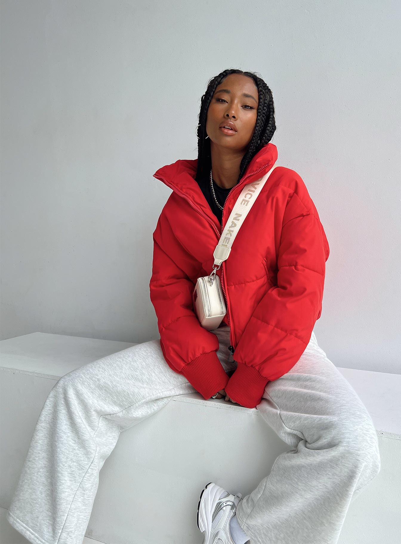 Puffer jacket High neck Zip front fastening Twin zip front pockets Ribbed cuffs Drawstring waist