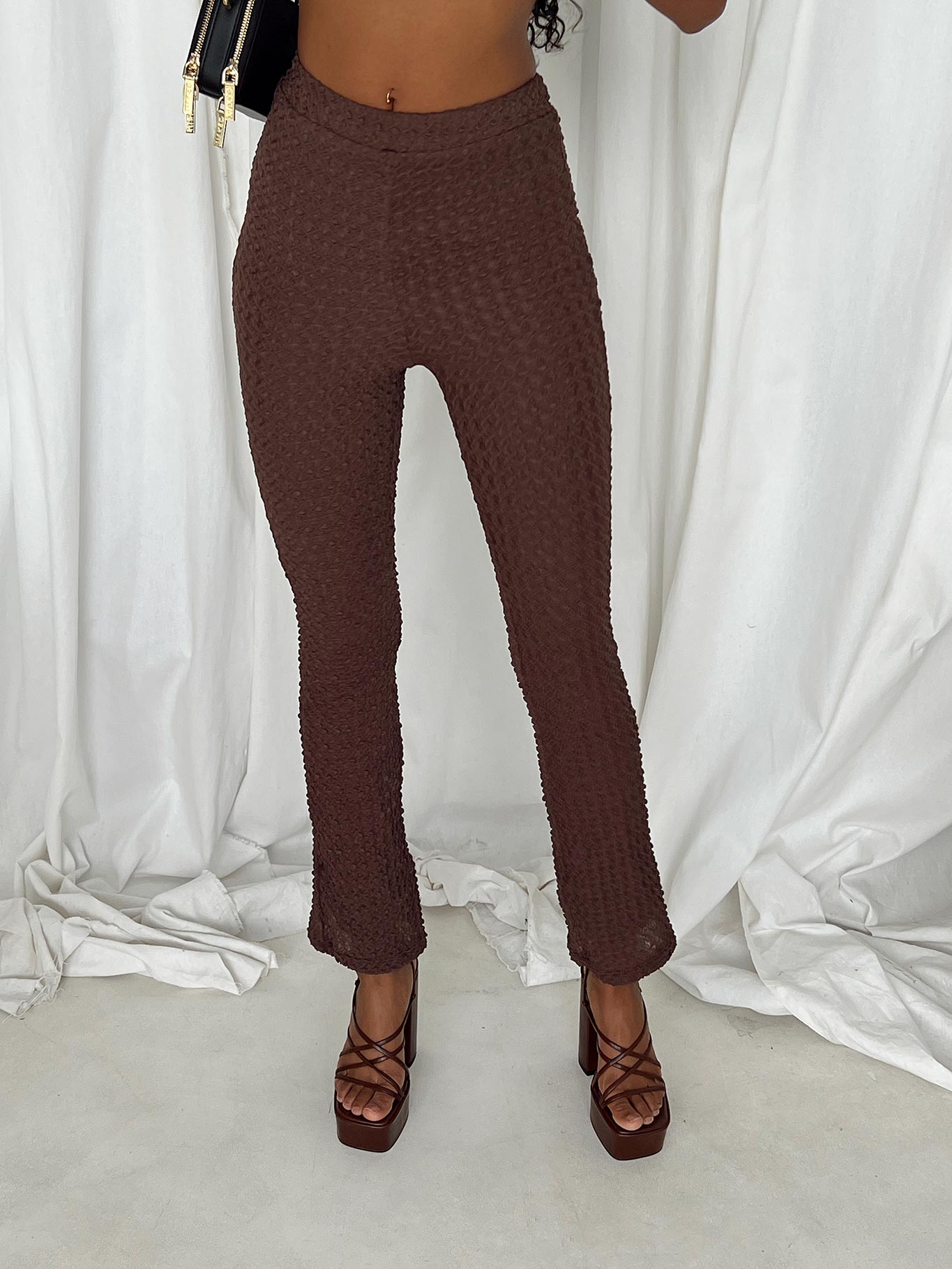 Matching set Popcorn material Strapless top Inner silicone strip at bust Side slit detail Invisible zip fastening at side Pants Elasticated waistband