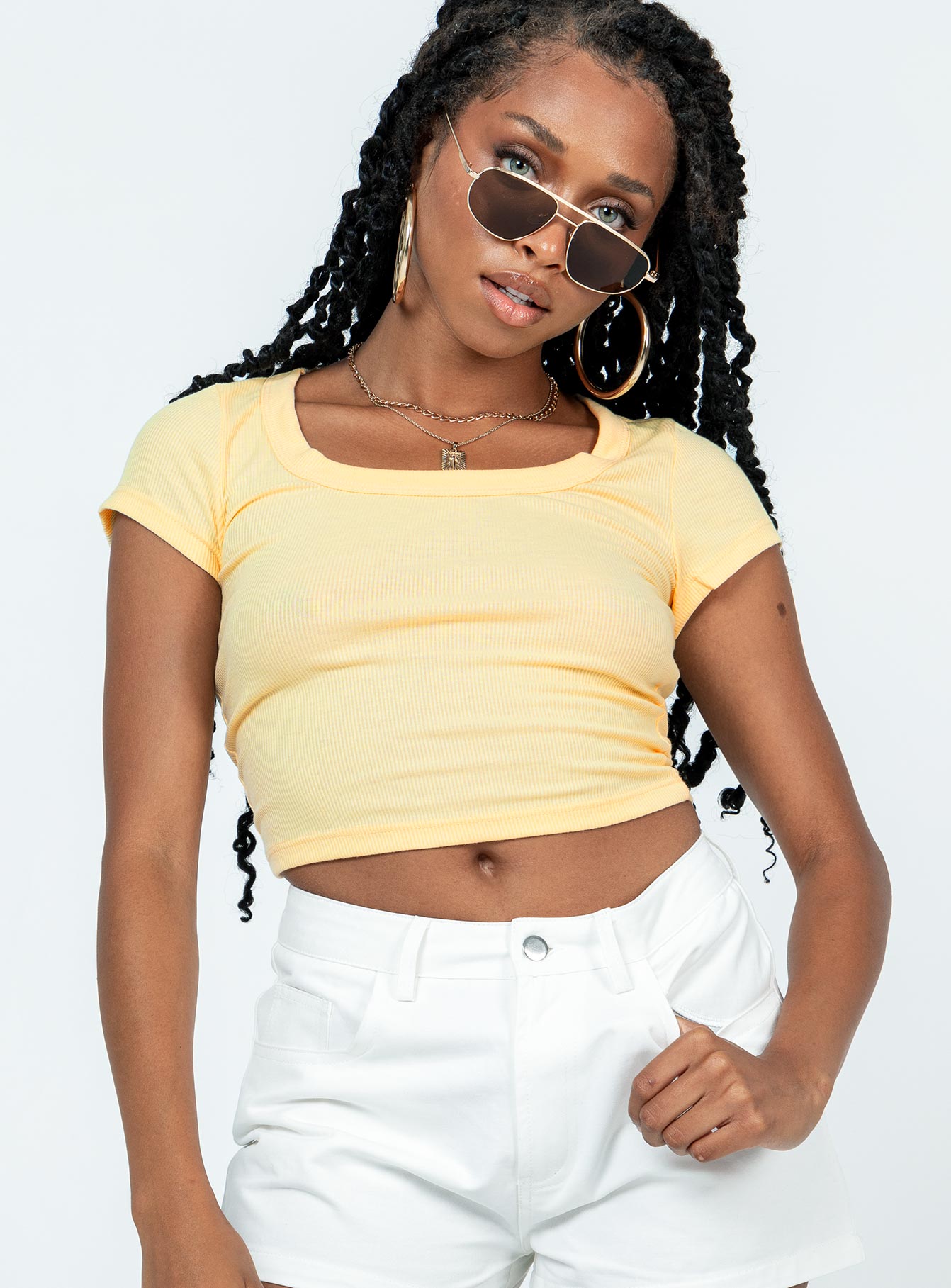 front view of model wearing Princess Polly Kerri Top Cream Short Sleeves Scoop Neck 