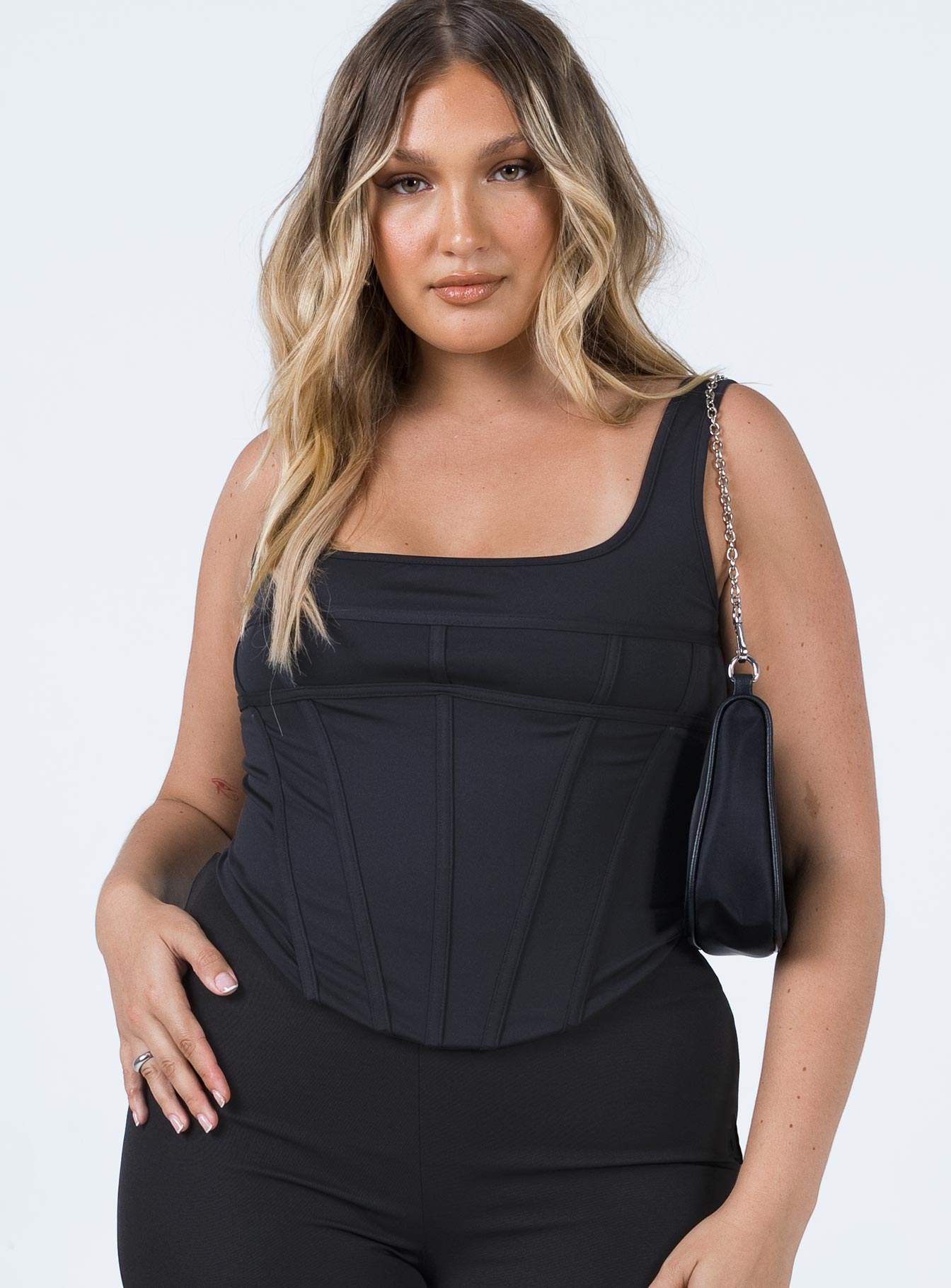front view of model wearing Princess Polly Normani Top Black Sleeveless Square Neck 