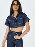 Cropped jacket Dark wash denim Short sleeves Classic collar Buttons fastening at front Twin chest pockets