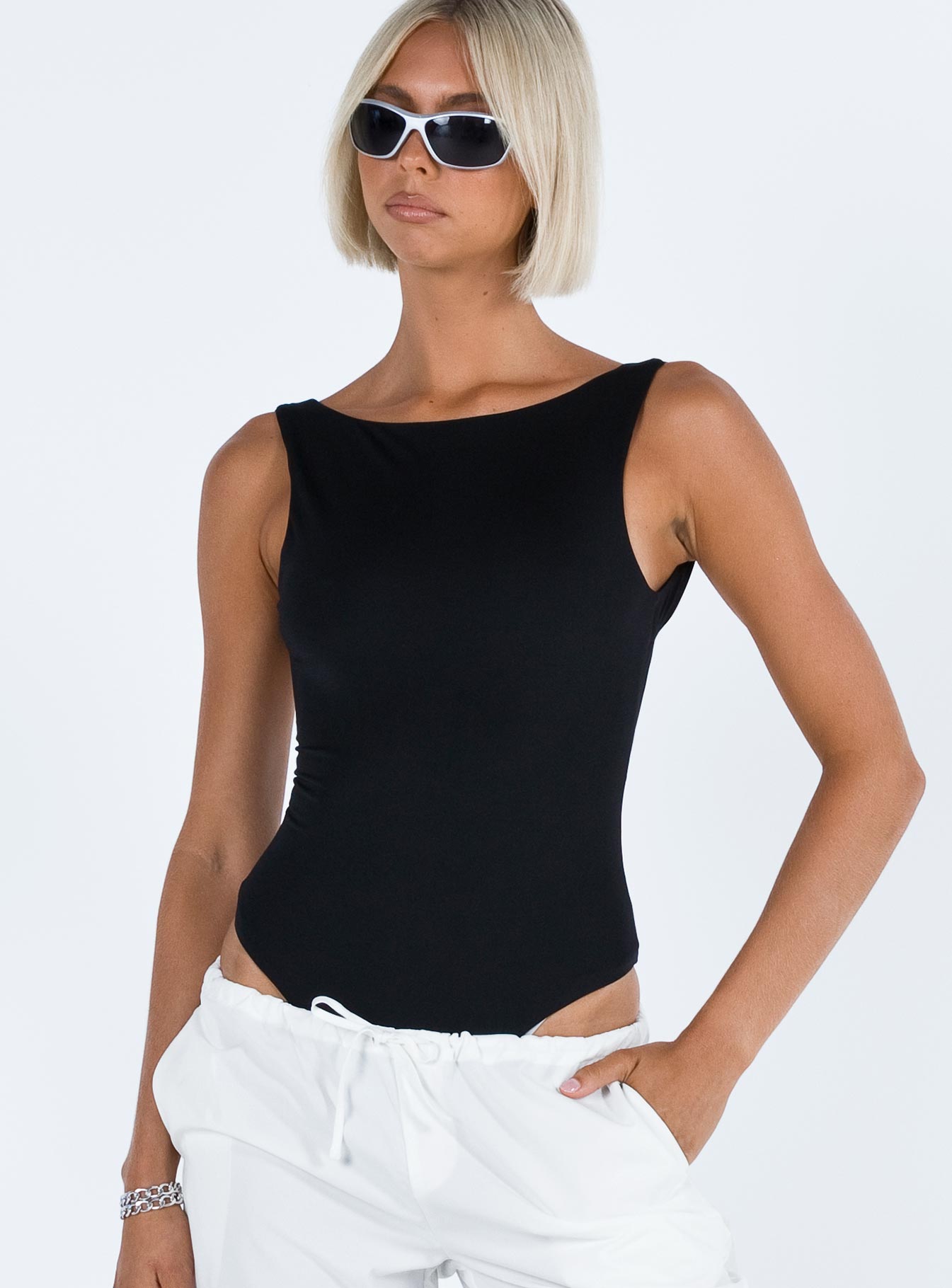 front view of model wearing Princess Polly Coomba Backless Bodysuit Black Sleeveless Scoop Neck 